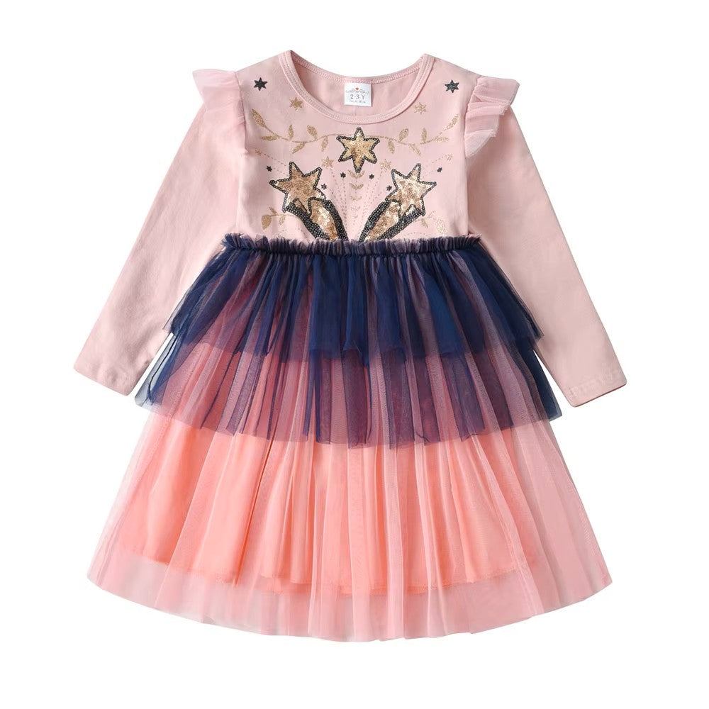 Pink dress with star design and layered tulle skirt on a white background