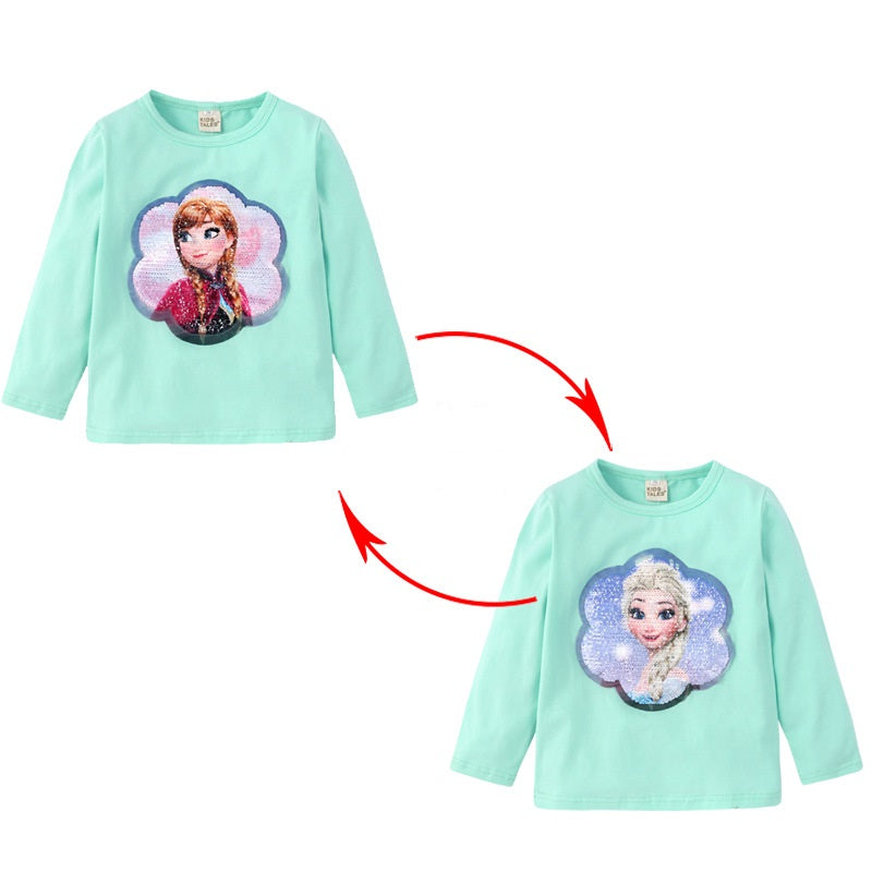A green baby shirt with a character from the movie Frozen on the front.