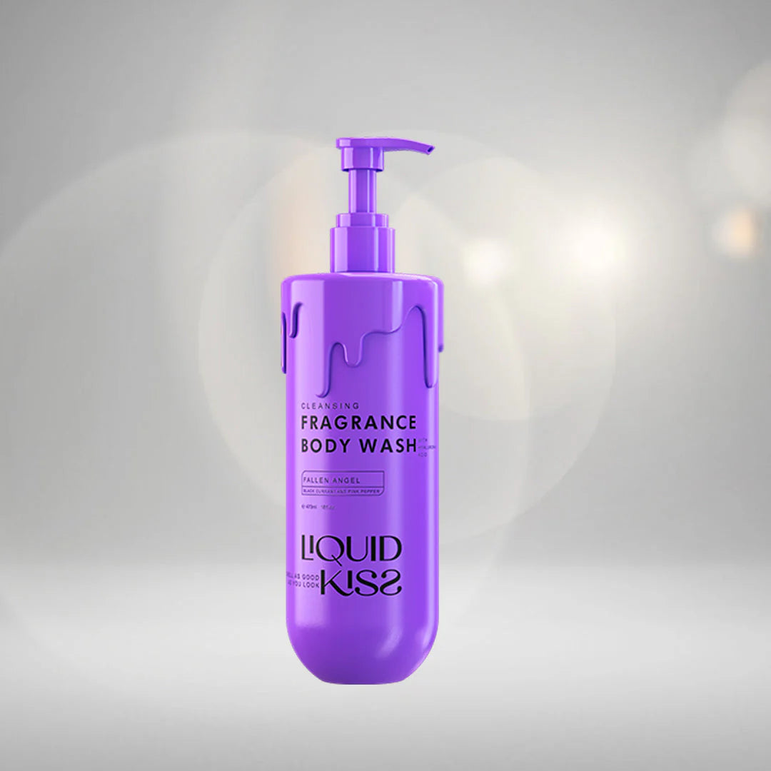 Purple bottle of Liquid Kiss fragrance body wash on a gray background