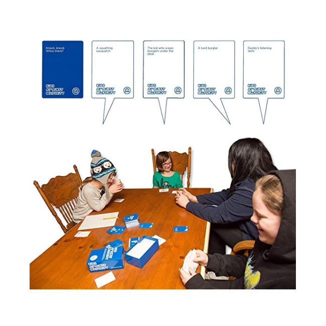 Children playing a card game around a wooden table with speech bubble cards above their heads.
