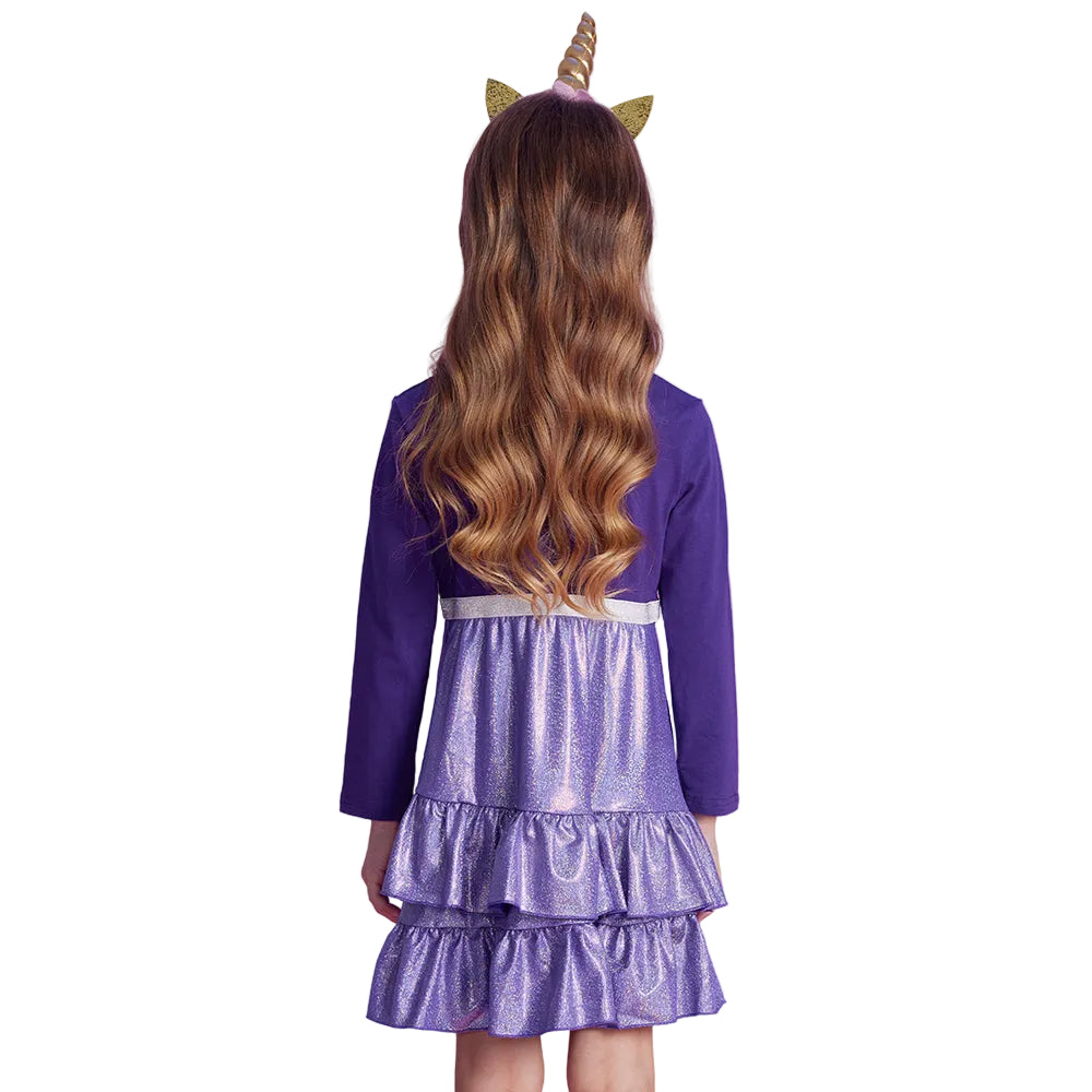 Child wearing a purple dress with a silver belt and gold horn on a white background