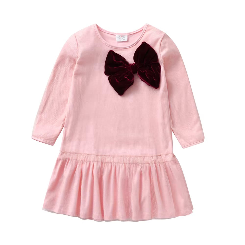 Pink dress with a large brown bow on a white background