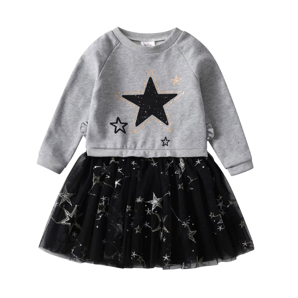 Children's outfit with gray sweater and black tulle skirt featuring star patterns on a white background.