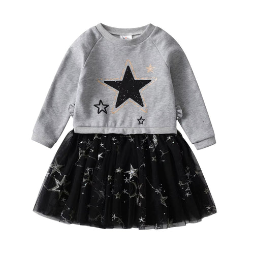 Children's outfit with gray sweater and black tulle skirt featuring star patterns on a white background.