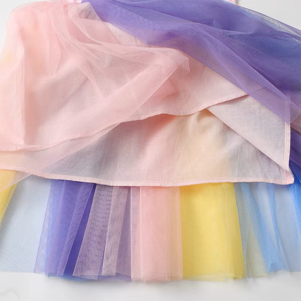 Pastel-colored tulle fabric in a stack on a white background