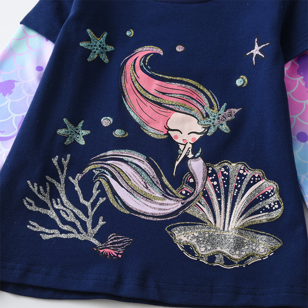 Mermaid design on a dark blue fabric with stars and shells.