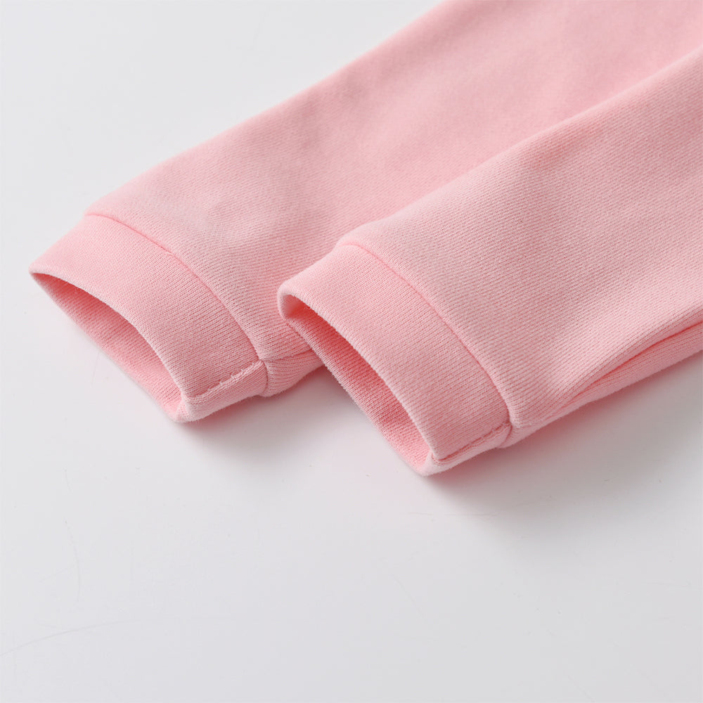 Close-up of pink fabric on a light gray background
