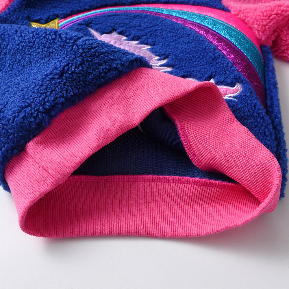 Close-up of a blue and pink fabric with a textured pattern on a white background