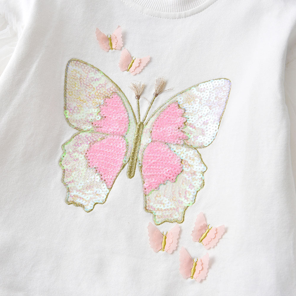 Sequined butterfly design on a white background