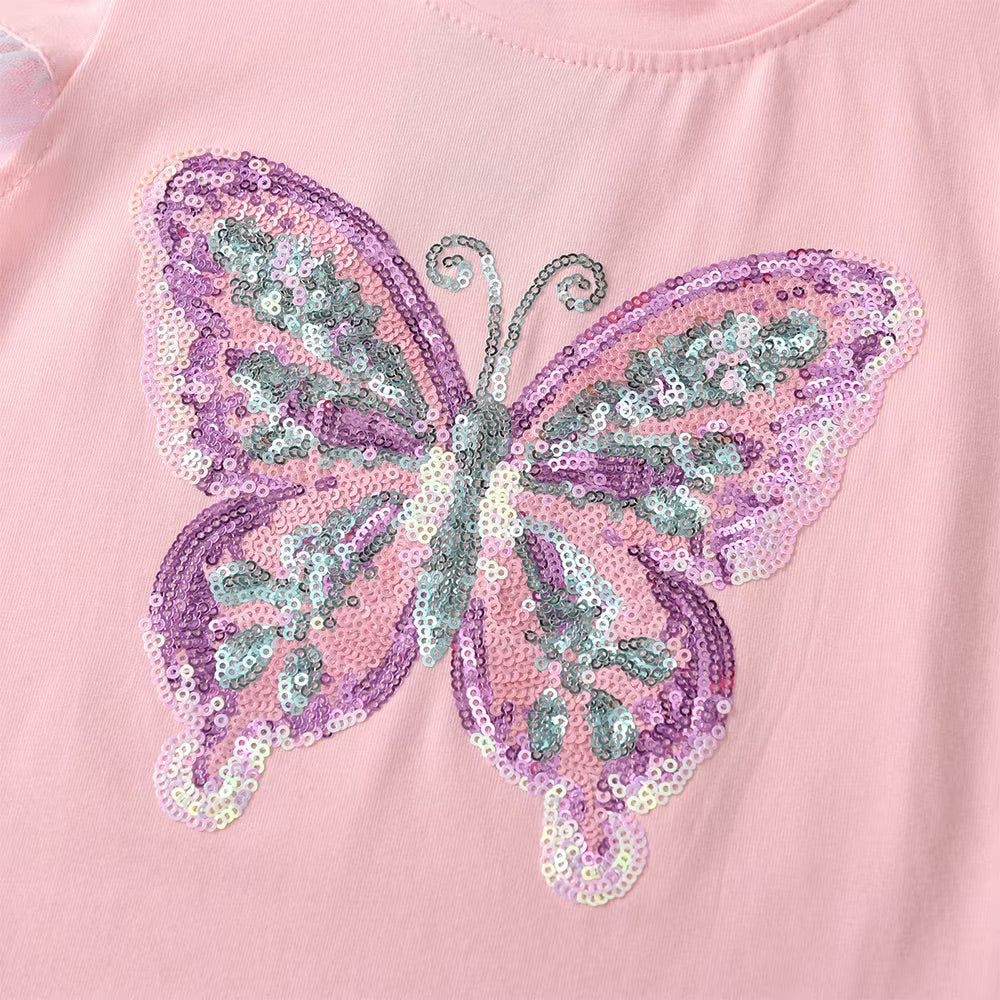 Sequined butterfly design on a pink background