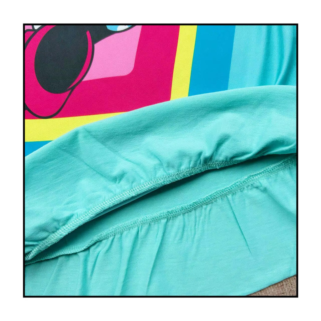 Close-up of turquoise fabric with colorful abstract pattern in the background