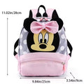 Backpack with cartoon character design and measurements on a white background