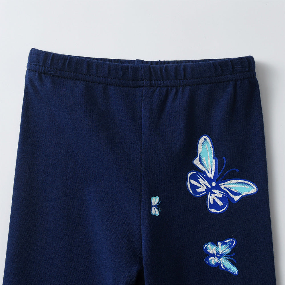 Navy blue pants with butterfly designs on a light gray background
