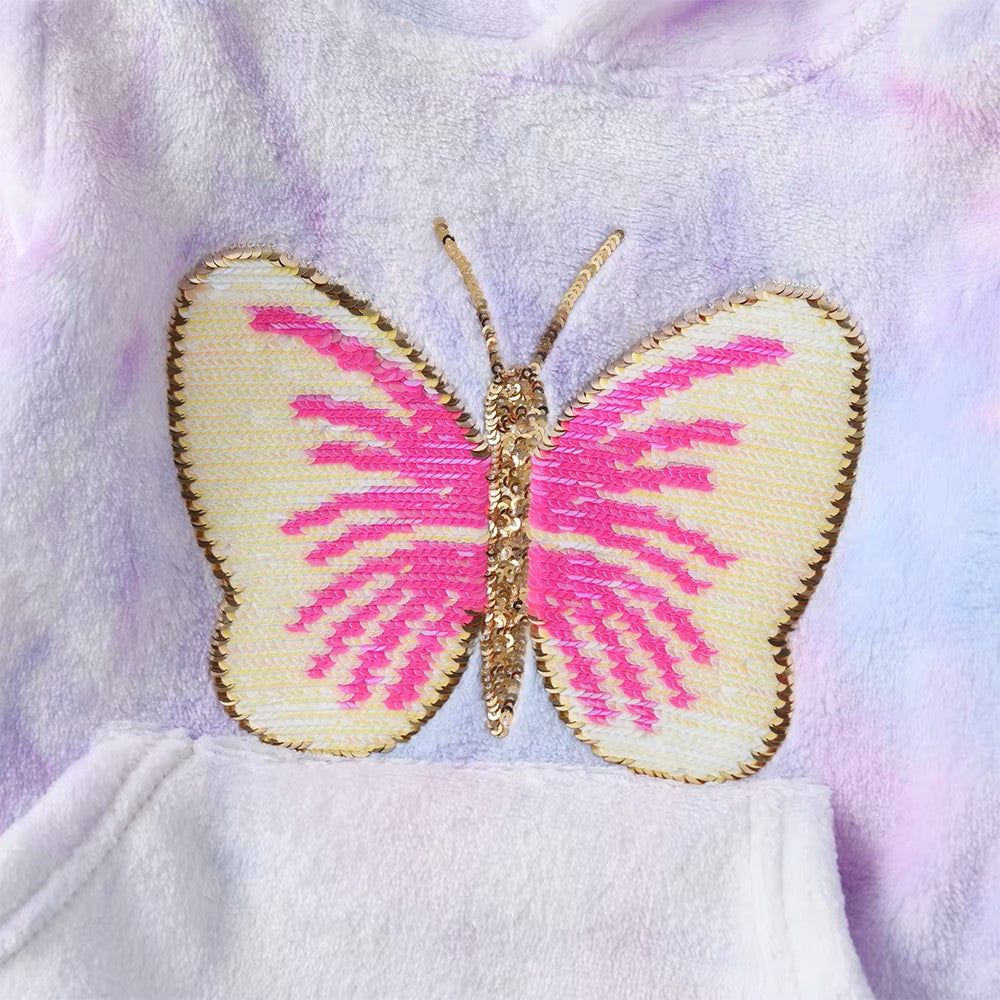 Butterfly-shaped patch with pink and gold design on a soft fabric background