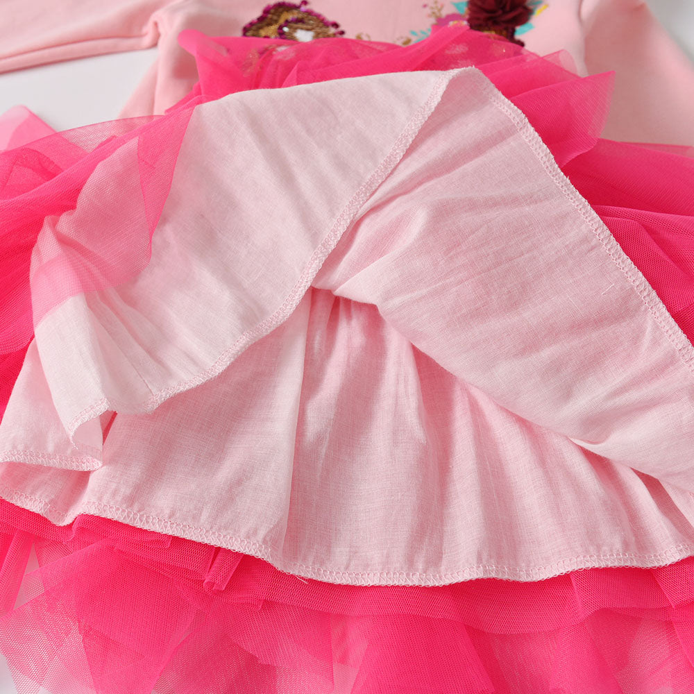 Close-up of a pink ruffled fabric with a blurred background