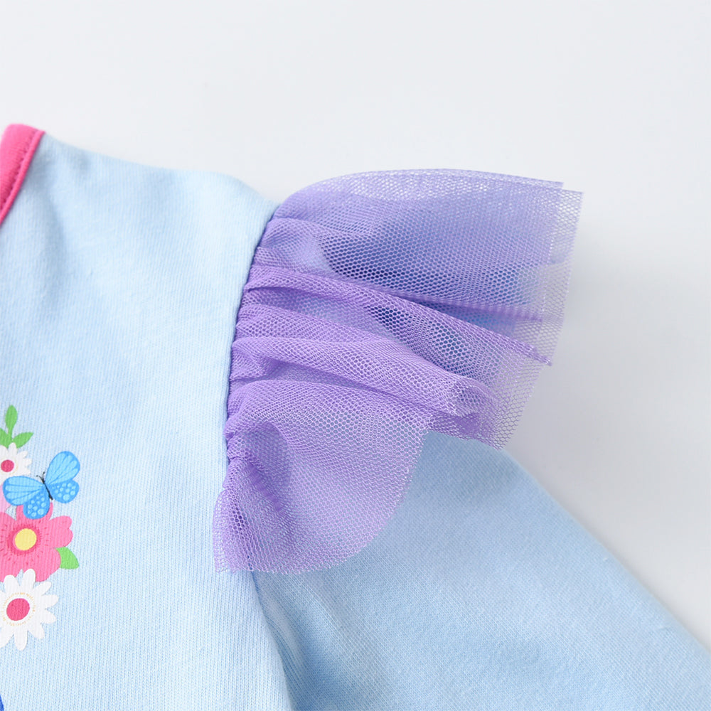Light blue dress with purple tulle and floral embroidery on a white background