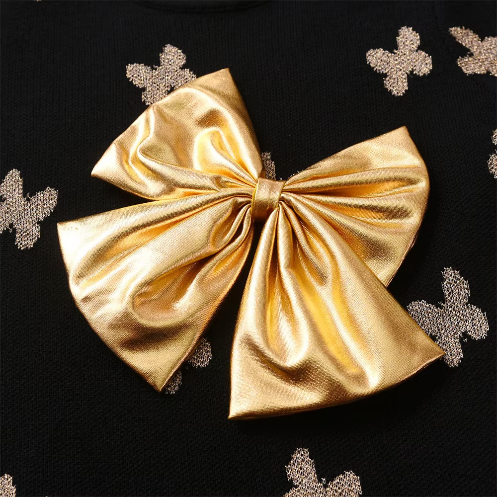 Gold bow with decorative butterflies on a black background