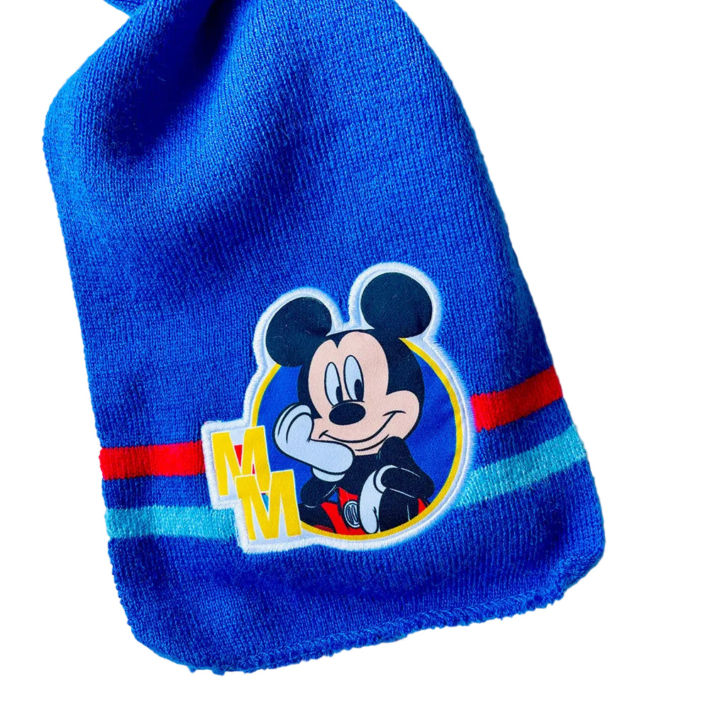 Blue knit beanie with a cartoon character logo on a white background