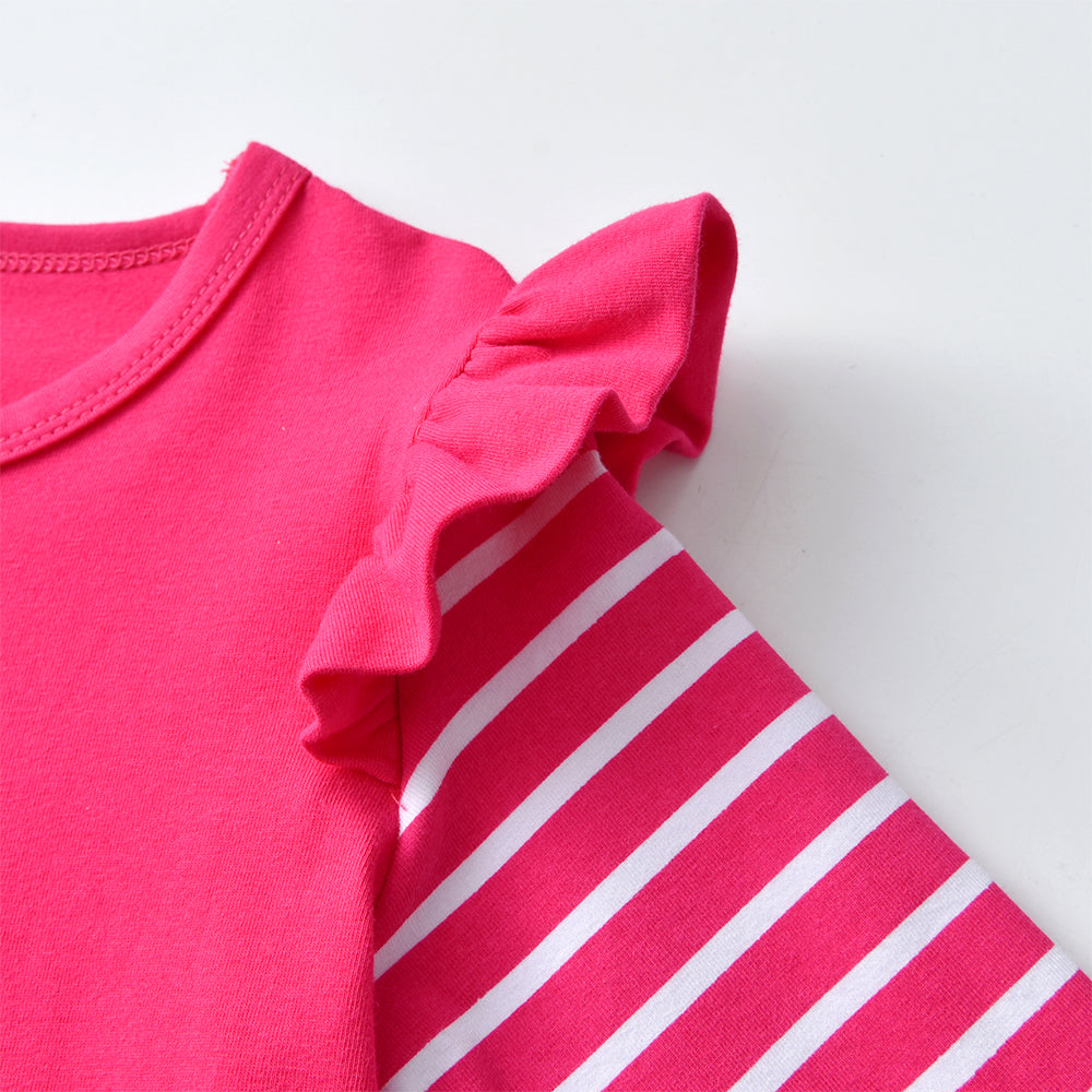 Close-up of a pink baby outfit with ruffled sleeves on a white background
