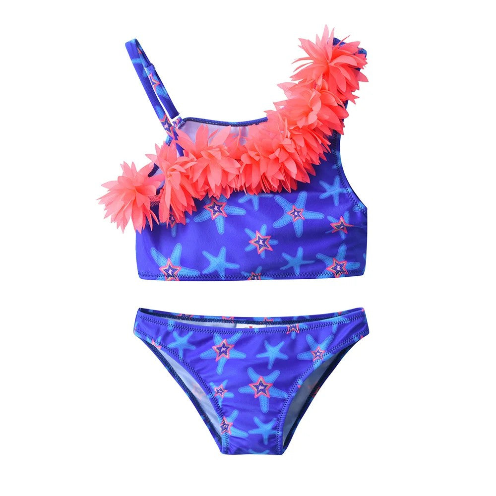Two-piece swimsuit with starfish pattern and pink floral accents on a white background