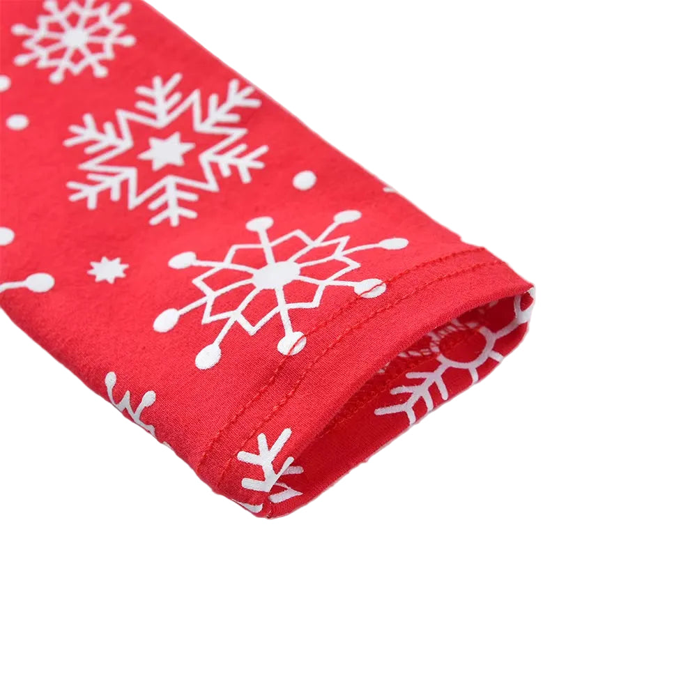 Red fabric with white snowflake patterns on a light gray background