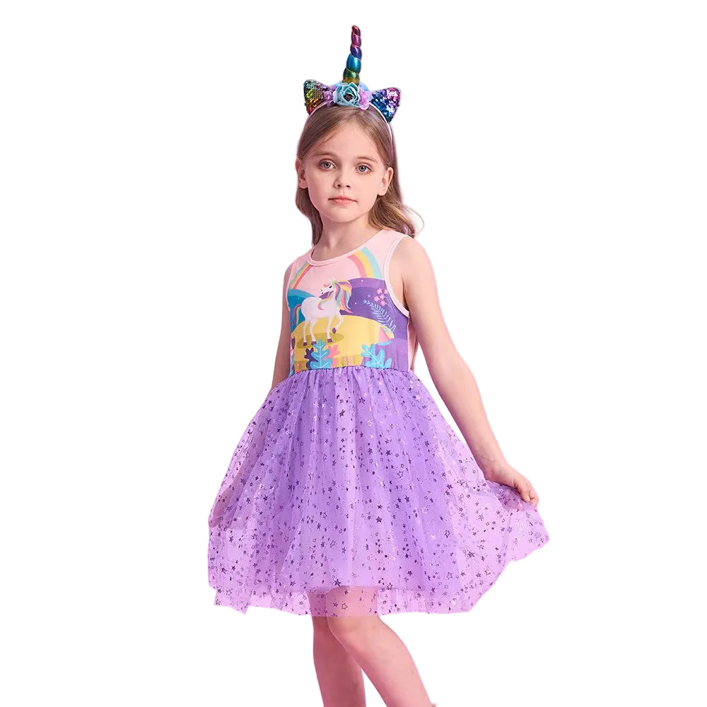 Young girl wearing a purple unicorn-themed dress and headband on a white background