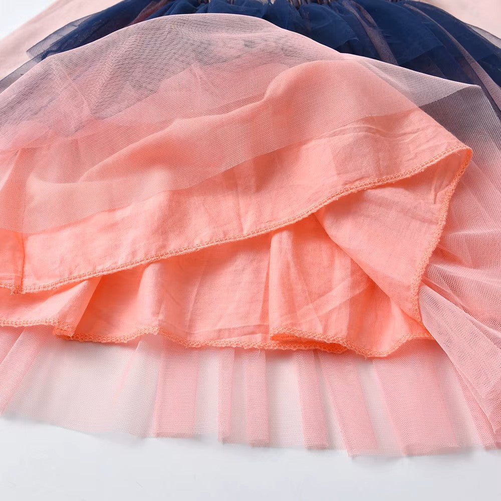 Close-up of layered fabric with pink, blue, and white colors.