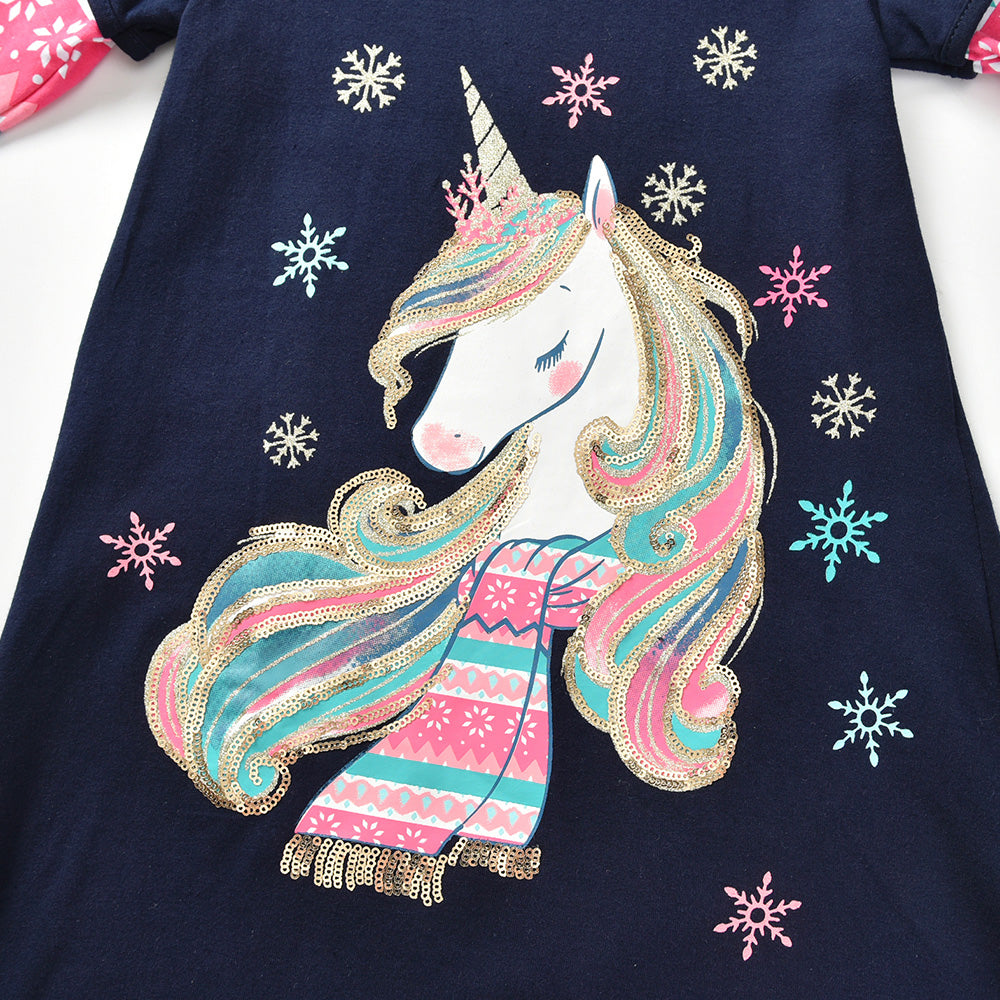 Navy blue shirt with a colorful unicorn design and snowflakes on a white background