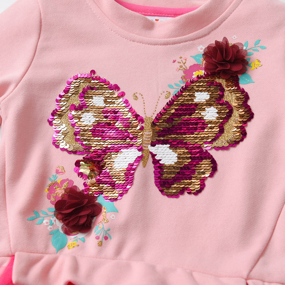 Pink sweatshirt with a butterfly design made of sequins on a pink background