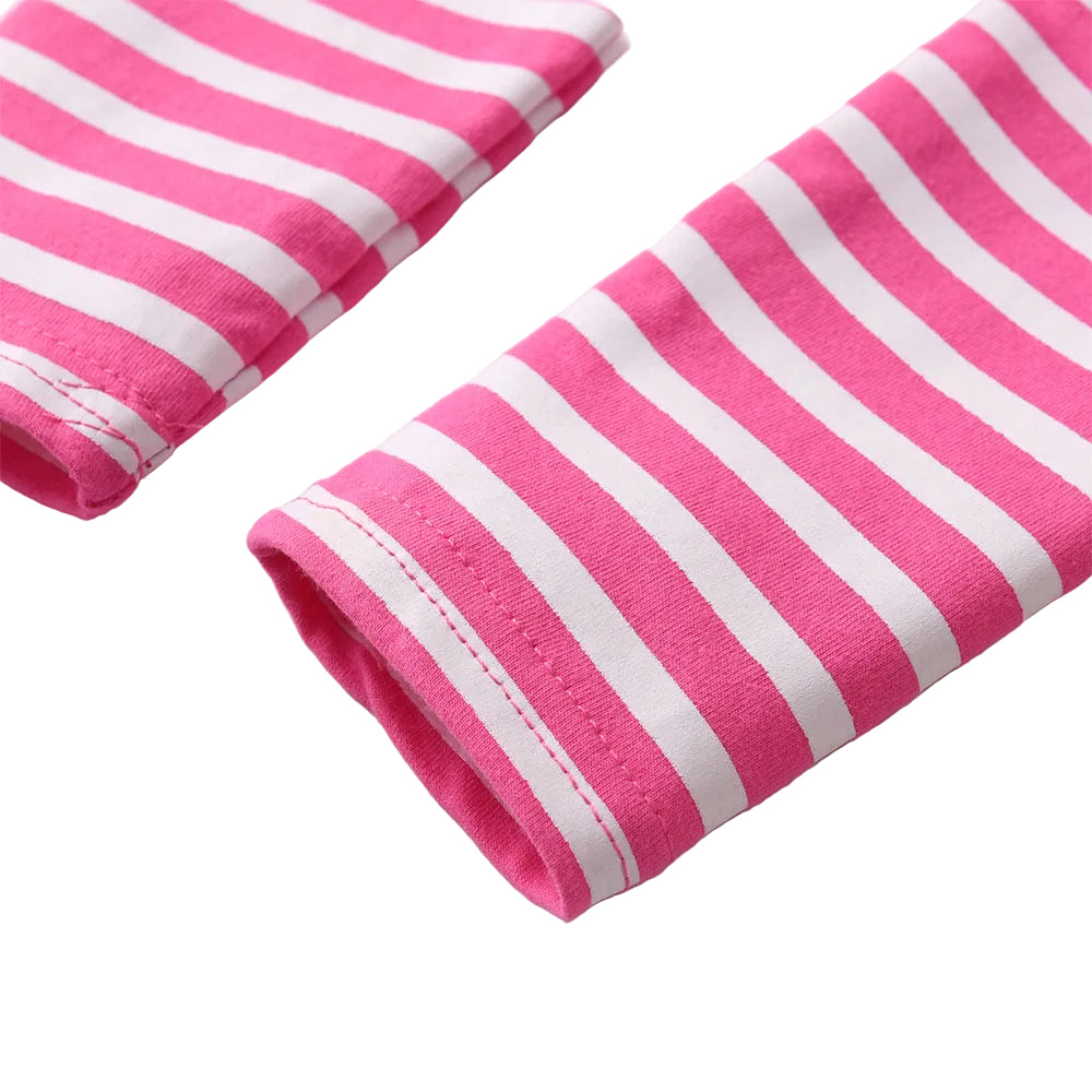 Two rolled-up pink and white striped towels on a light background