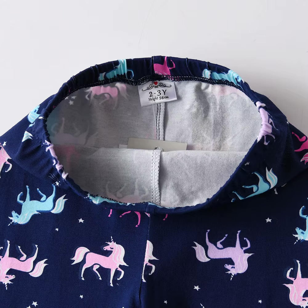 Navy blue fabric with unicorn pattern, white lining, and a size tag on a white background