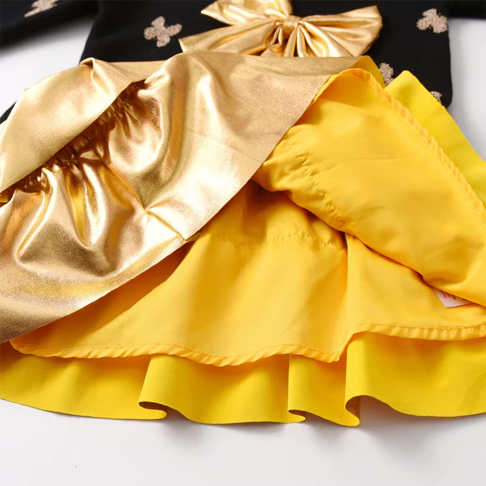 Yellow fabric with gold trim on a white background