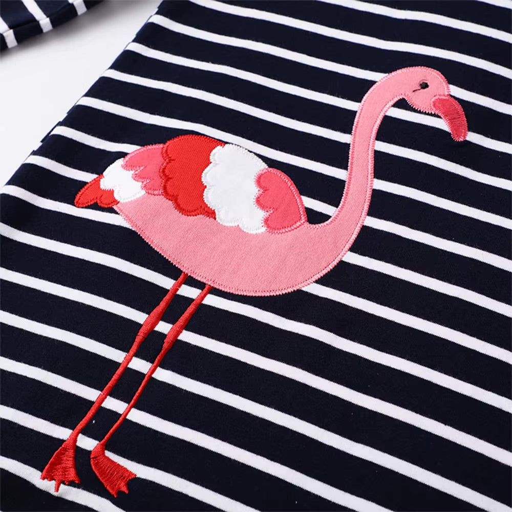Pink flamingo patch on a black and white striped fabric