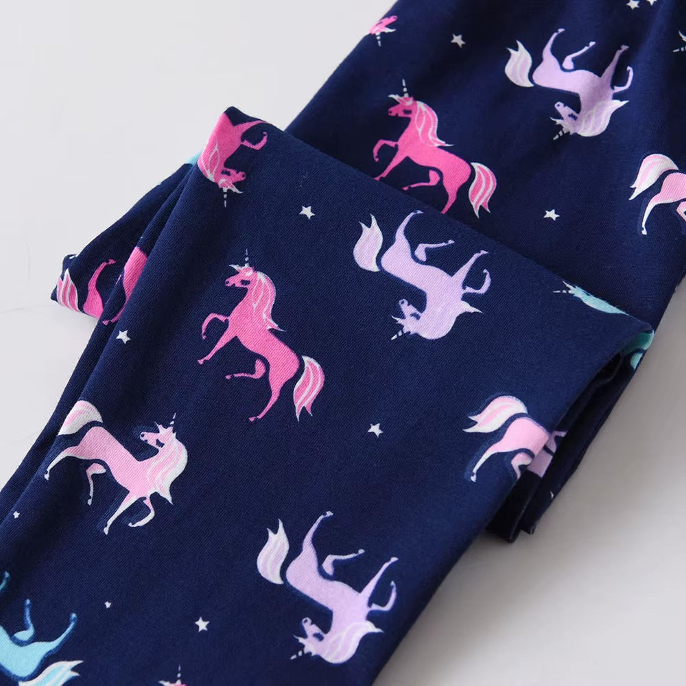 Navy blue fabric with pink and white unicorn pattern on a light gray background