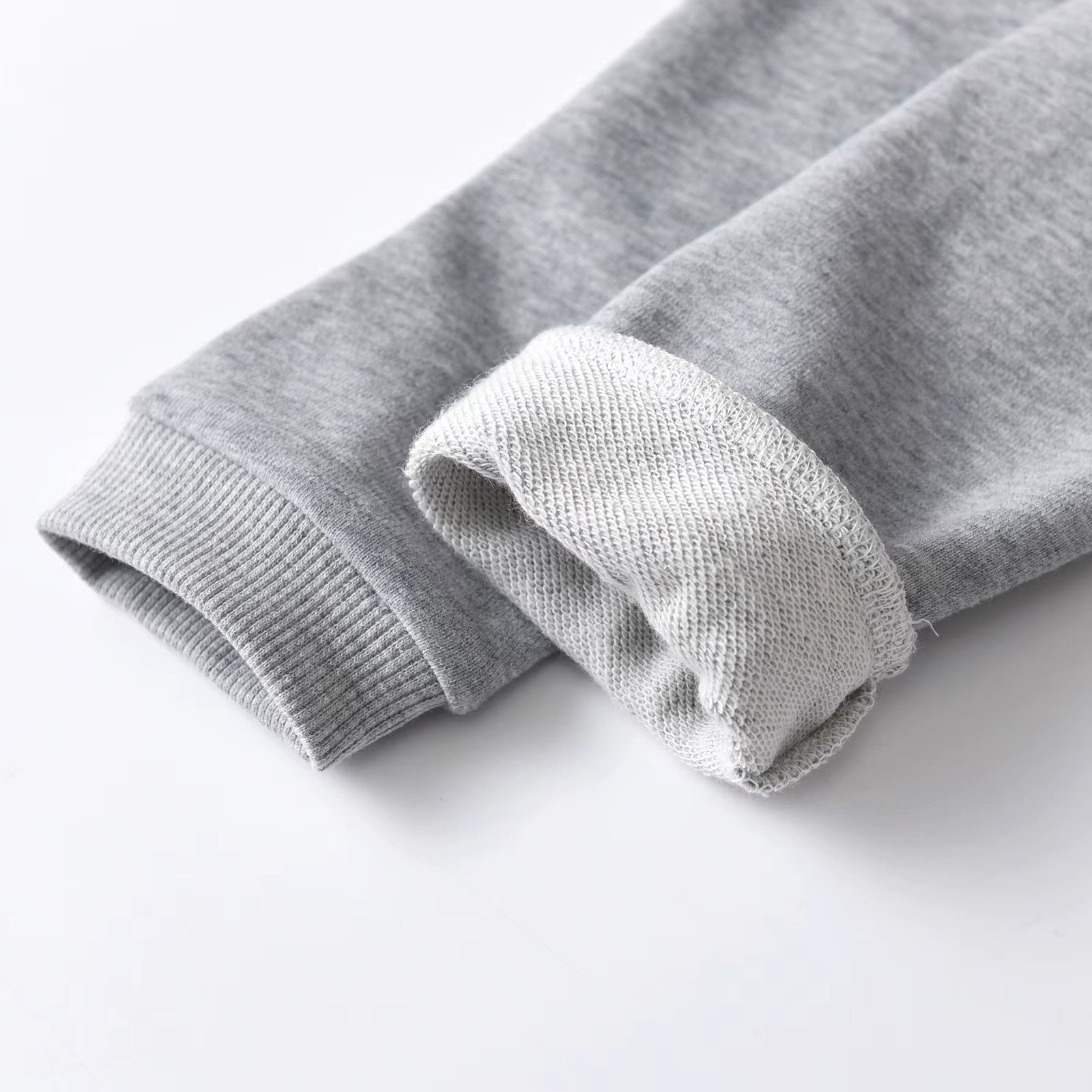 Close-up of gray knit fabric on a white background