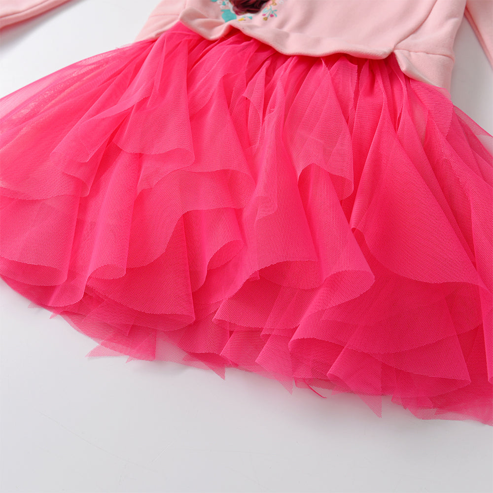 Close-up of a pink tulle skirt on a white background
