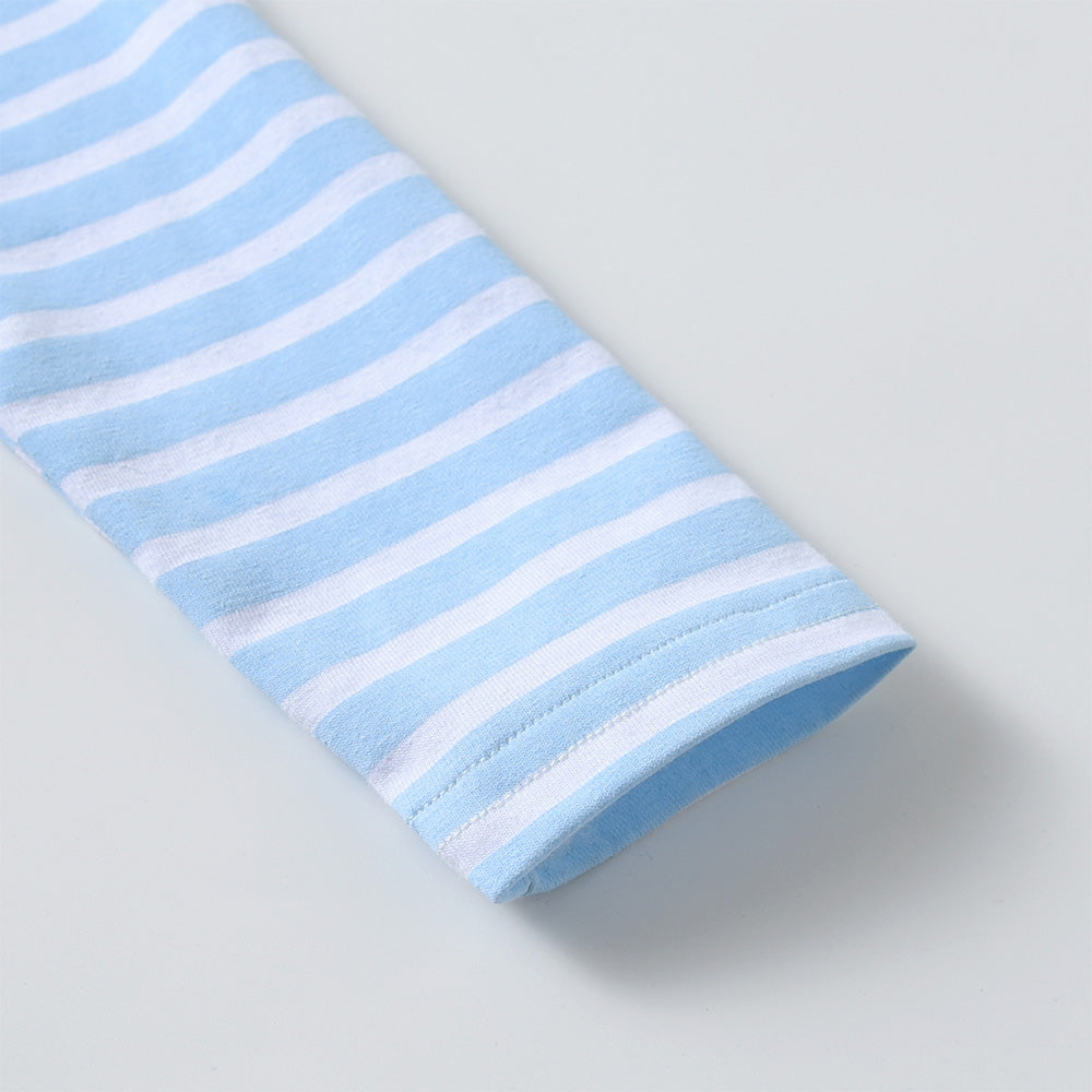 Blue and white striped fabric on a light gray background