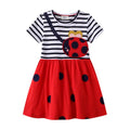 Striped dress with ladybug design on a white background