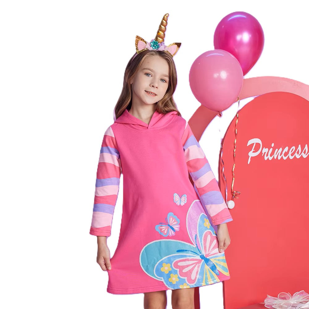 Child wearing a pink dress with butterfly designs and a unicorn horn headband, standing next to pink balloons and a 'Princess' sign.