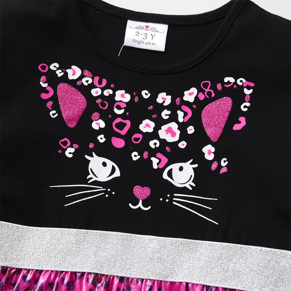 Black dress with pink and white cat design on a white background