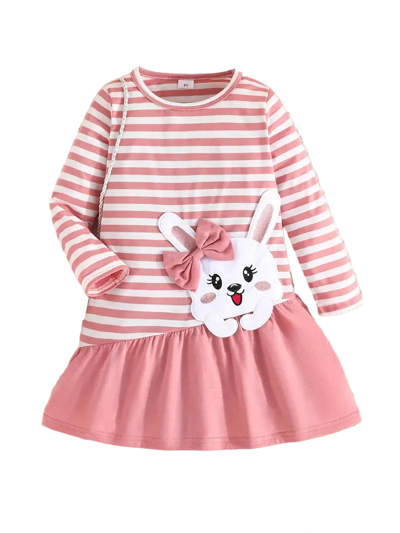 Pink and white striped dress with a cartoon bunny design on a textured surface.