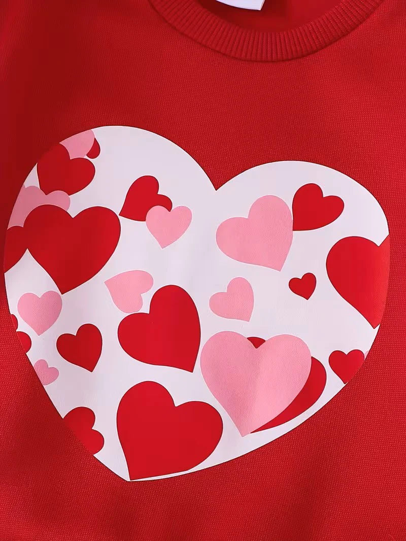 Red sweatshirt with a large white heart design featuring red and pink hearts on a red background.