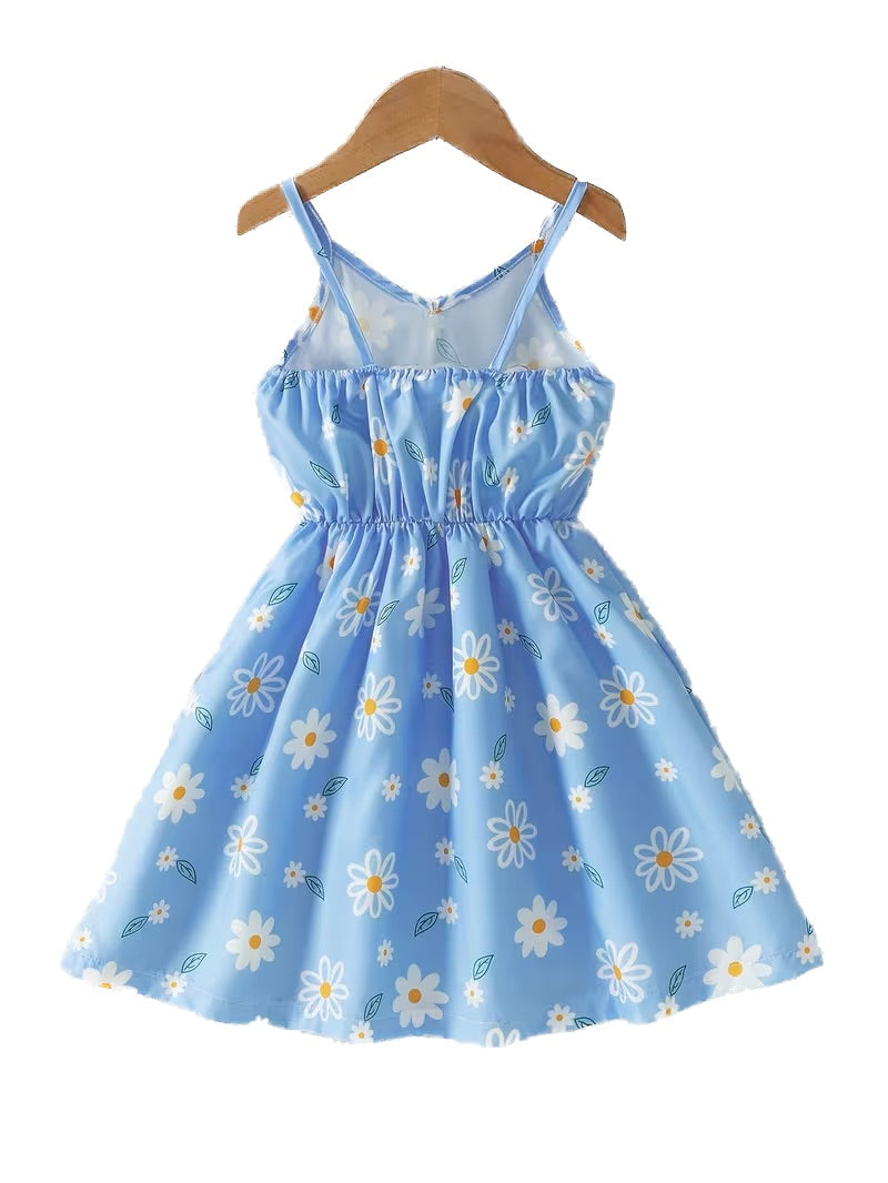 Blue floral dress on a wooden hanger against a white background