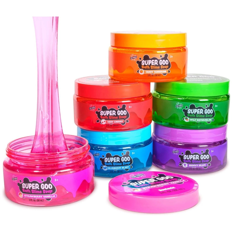Colorful containers of Super Goo bath slime with a pink spoon on a white background