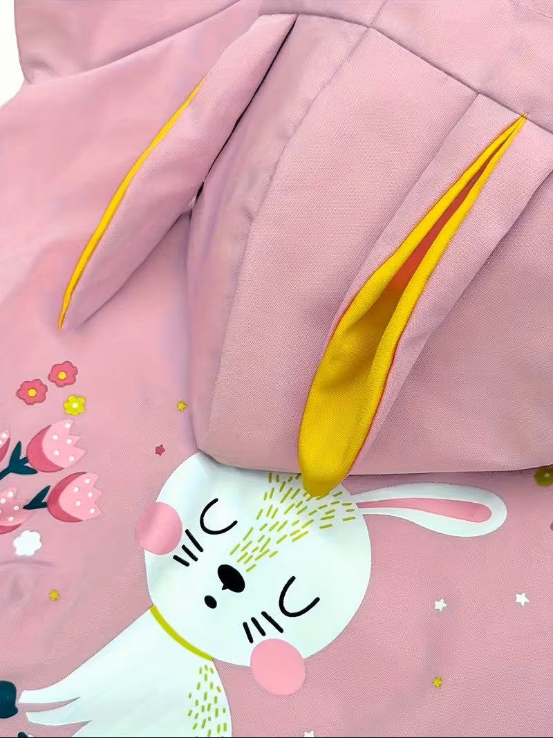 Close-up of a pink hoodie with cartoon character design on a white background