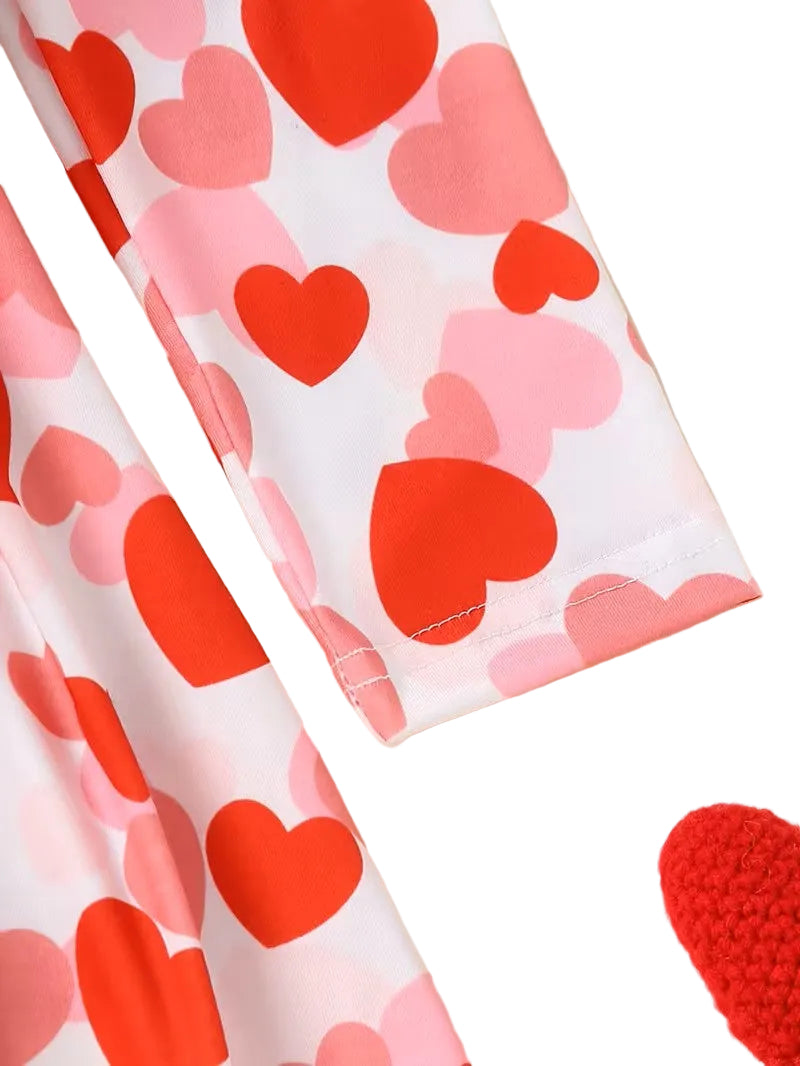 Heart-patterned fabric with red and pink hearts on a white background