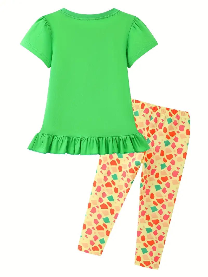 Green top and colorful patterned pants set on a white background