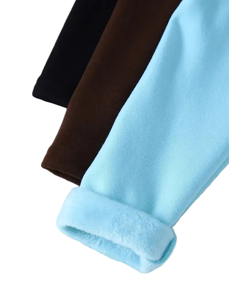 Three pairs of leggings in black, brown, and light blue on a white background