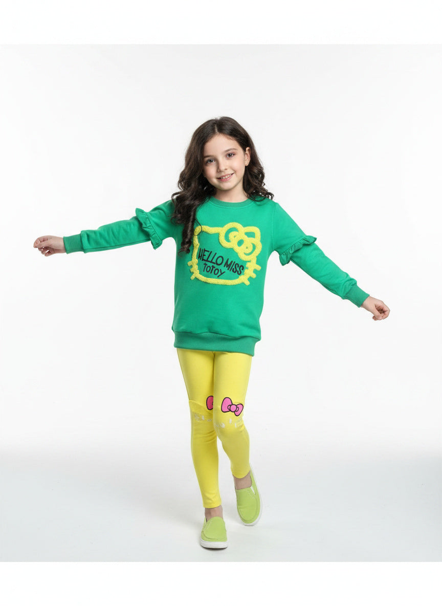 girl model in totoy green and yellow cotton outfit 