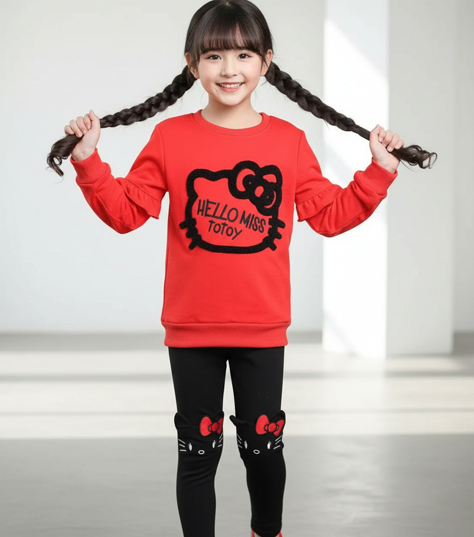 girl mdoel in totoy ed and black outfit 